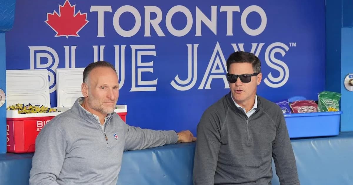 Dan Shapiro and Ross Atkins in the Toronto Blue Jays dugout.