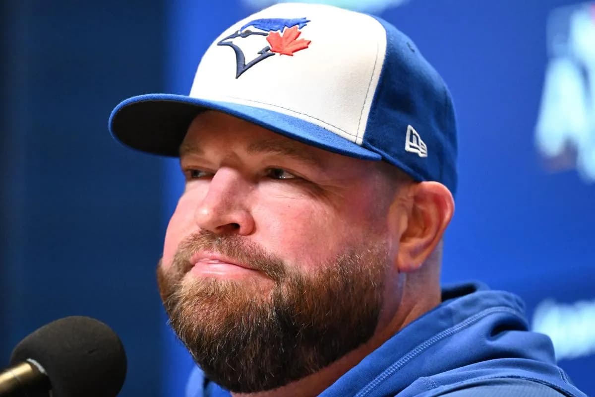 Toronto Blue Jays manager John Schneider (14) speaks to the media during workouts for the American League Championship Series at Rogers Centre.