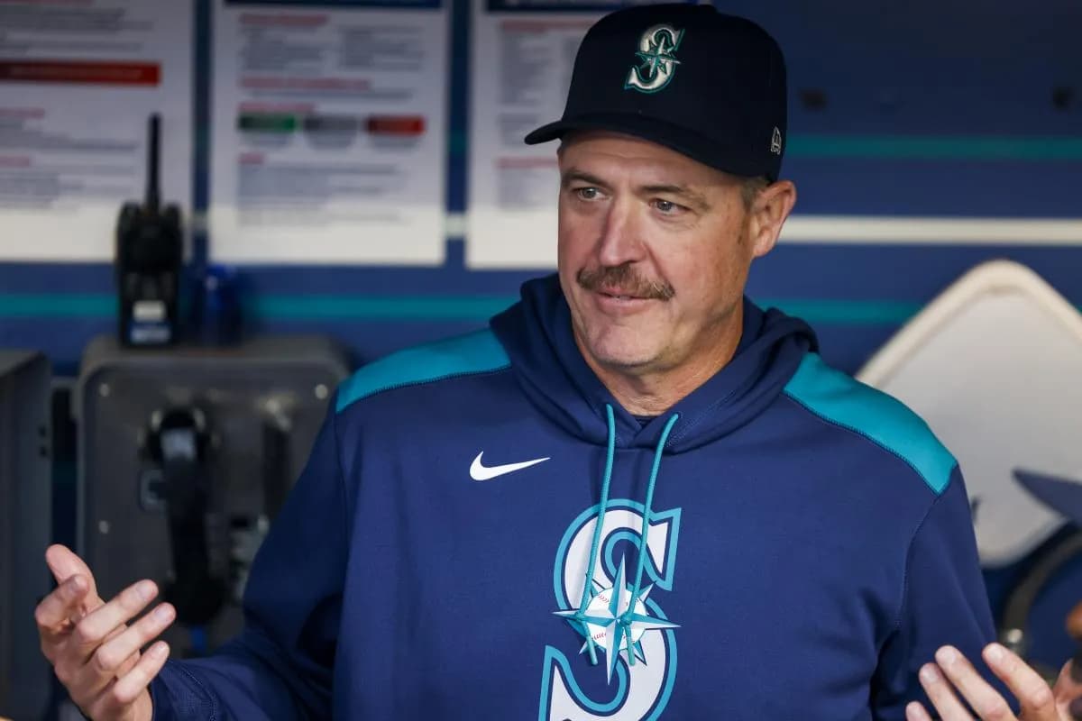 Seattle Mariners manager Dan Wilson (6) talks in the dugout before a game against the Colorado Rockies at T-Mobile Park.
