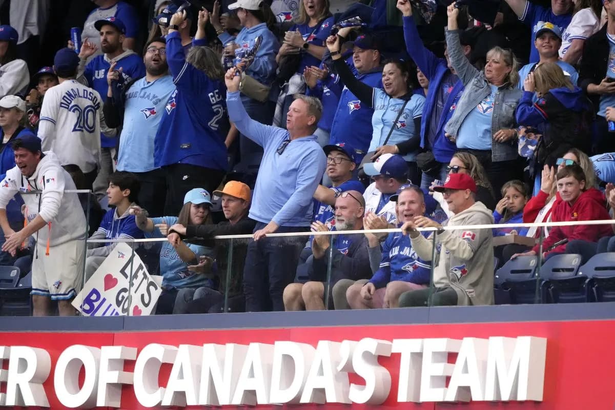 Toronto Blue Jays fans celebrate in the third inning against the Seattle Mariners during game two of the ALCS round for the 2025 MLB playoffs at Rogers Centre
