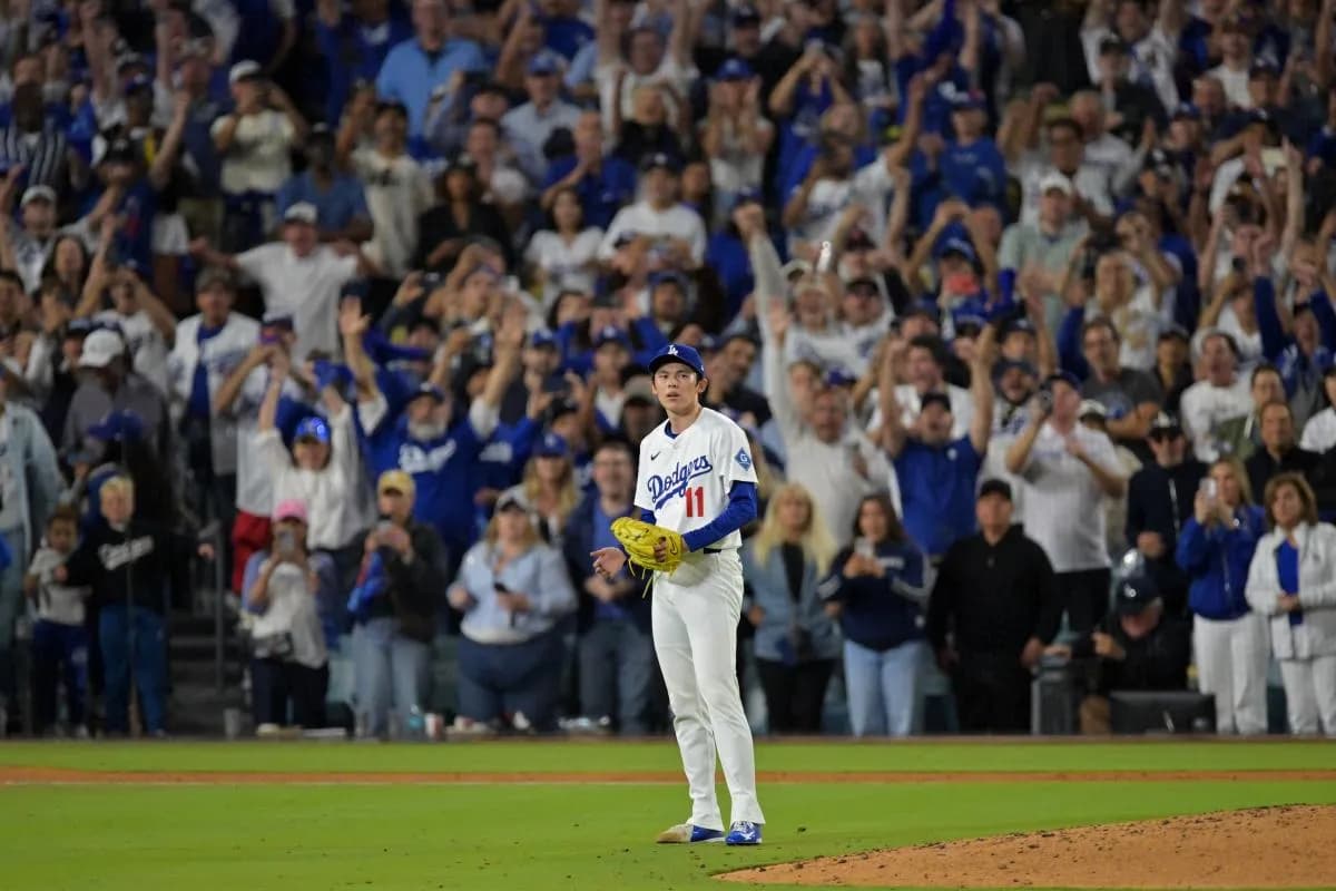 Los Angeles Dodgers pitcher Roki Sasaki (11) reacts after the final out of game five of the NLCS in the 2025 MLB playoffs defeating the Milwaukee Brewers at Dodger Stadium.