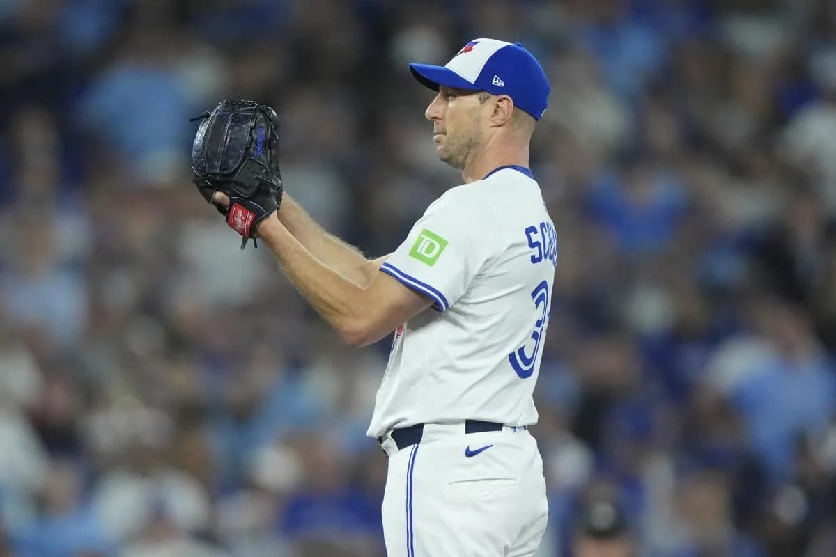 Toronto Blue Jays pitcher Max Scherzer (31) pitches against the Los Angeles Dodgers in the first inning during game seven of the 2025 MLB World Series at Rogers Centre.