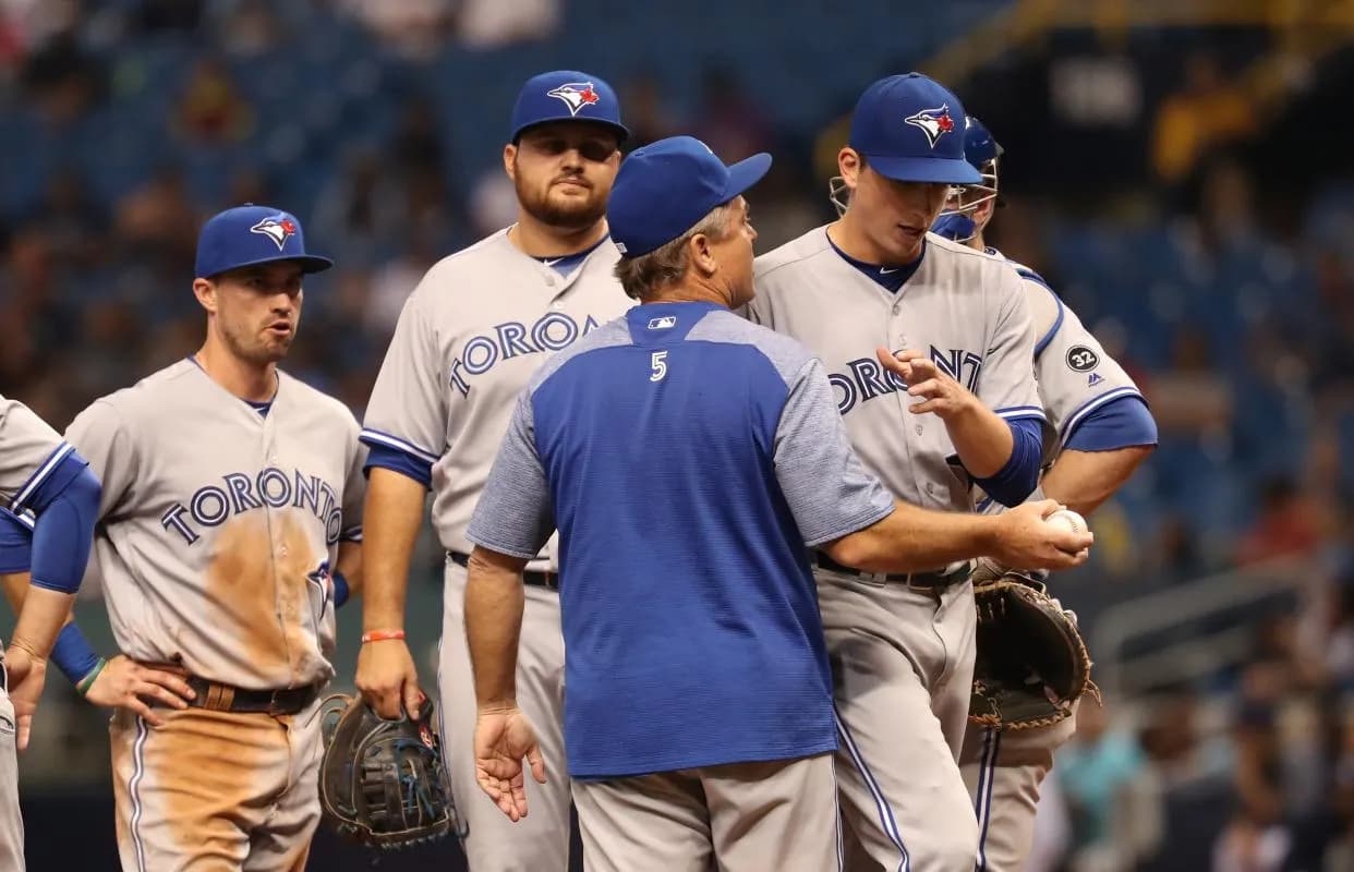 Toronto Blue Jays manager John Gibbons (5) comes to the mound to take out starting pitcher Ryan Borucki (56) during the seventh inning against the Tampa Bay Rays at Tropicana Field.