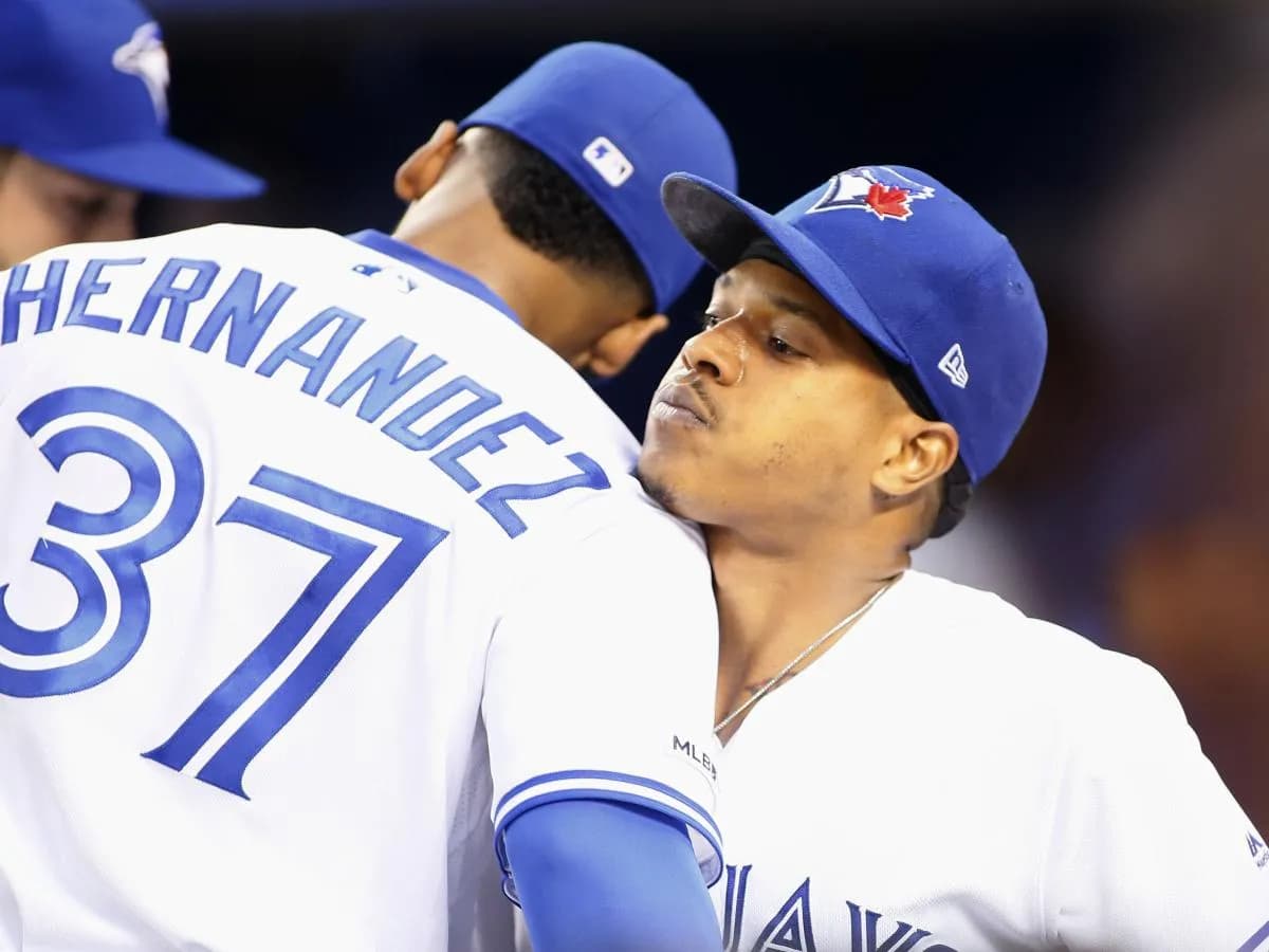 Toronto Blue Jays center fielder Teoscar Hernandez (37) embraces starting pitcher Marcus Stroman (6) at the end of the seventh inning against the Cleveland Indians at Rogers Centre.