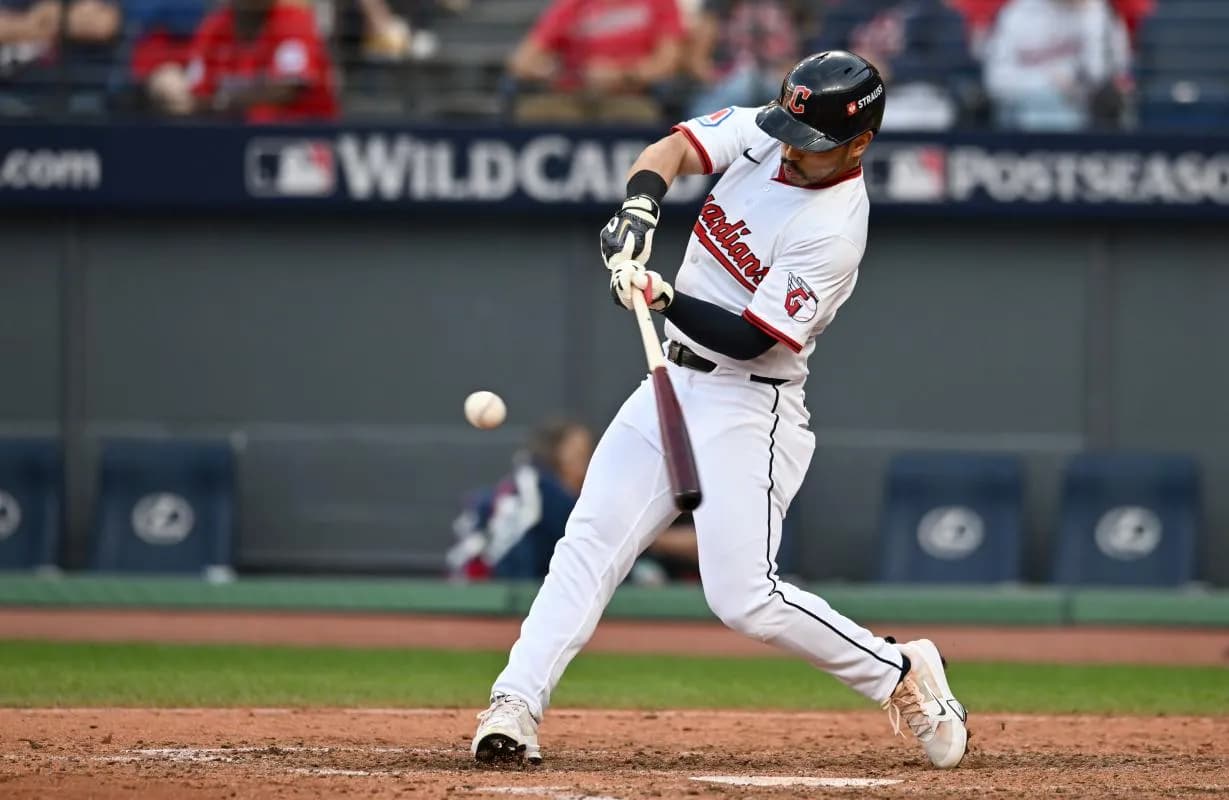 Cleveland Guardians outfielder Steven Kwan (38) hits a double in the eighth inning against the Detroit Tigers during game three of the Wildcard round for the 2025 MLB playoffs at Progressive Field.