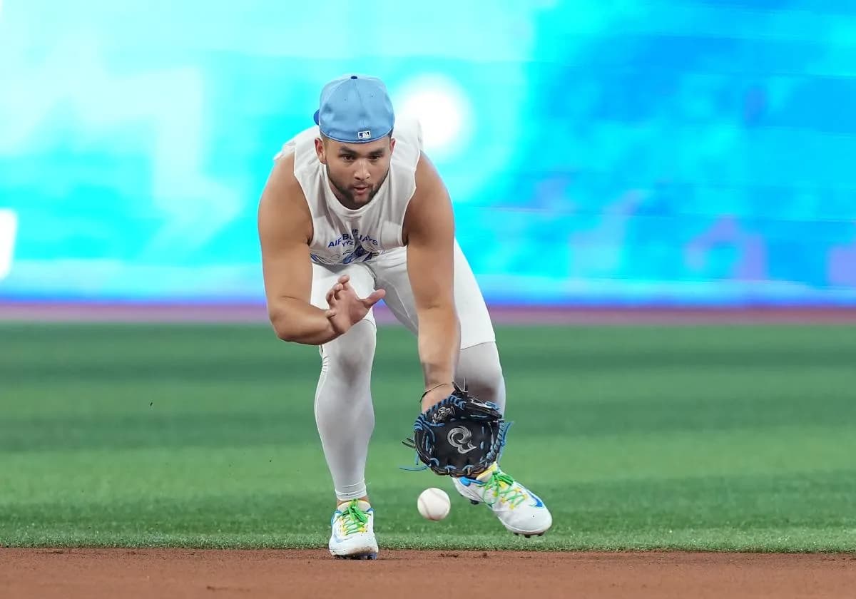 Toronto Blue Jays shortstop Bo Bichette (11) fields the ball during batting practice before a game against the New York Yankees at Rogers Centre.
