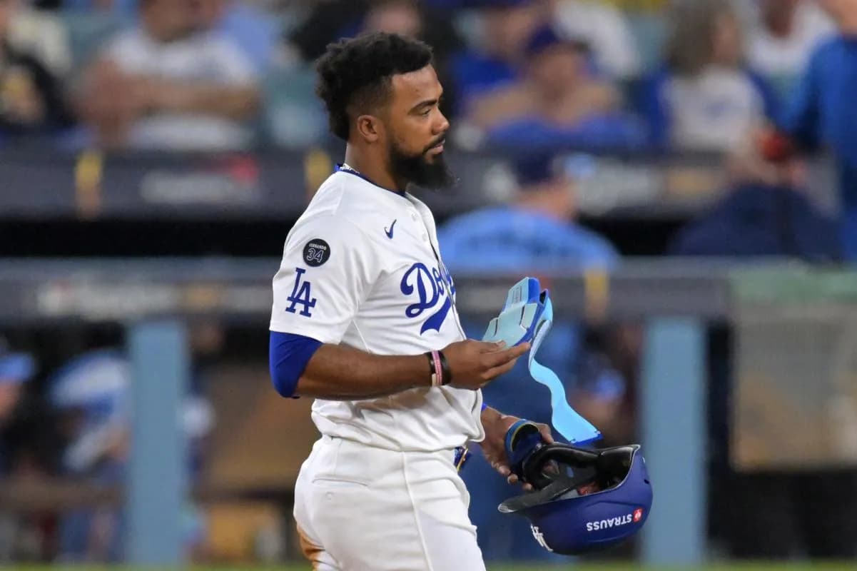 Los Angeles Dodgers right fielder Teoscar Hernandez (37) reacts after getting out a double play by Toronto Blue Jays second baseman Isiah Kiner-Falefa (7) in the seventh inning during game five of the 2025 MLB World Series at Dodger Stadium.