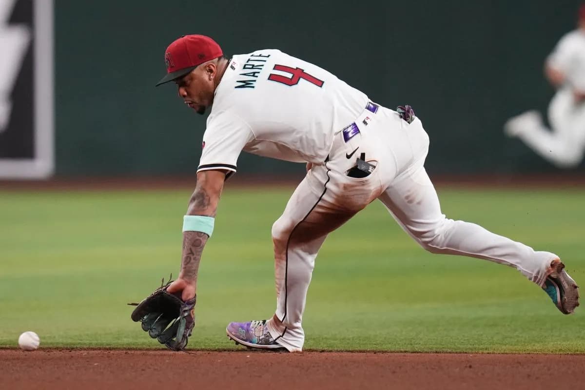 Arizona Diamondbacks infielder Ketel Marte (4) scoops up a ground ball against the Los Angeles Dodgers at Chase Field in Phoenix, on Sept. 24, 2025.