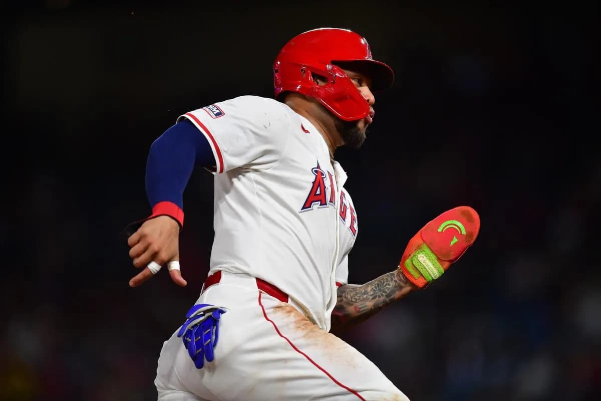 Los Angeles Angels third baseman Yoán Moncada (5) runs home to score against the Minnesota Twins during the fifth inning at Angel Stadium.