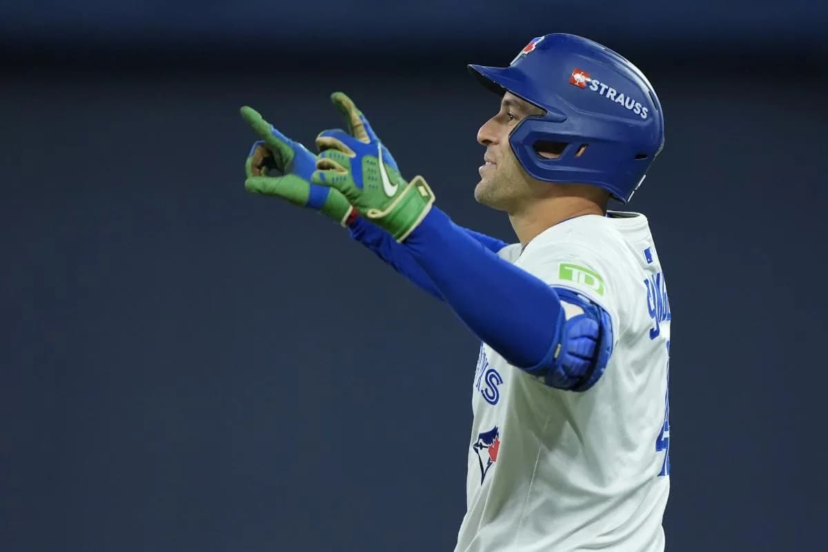 Toronto Blue Jays right fielder George Springer (4) reacts after hitting a single in the fourth inning against the Los Angeles Dodgers during game seven of the 2025 MLB World Series at Rogers Centre.