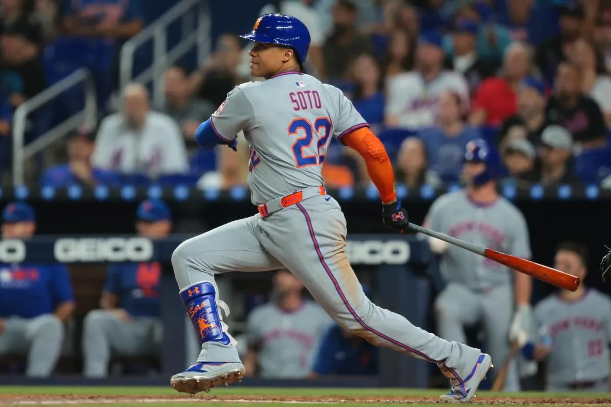 New York Mets right fielder Juan Soto (22) hits a single against the Miami Marlins during the third inning at loanDepot Park.
