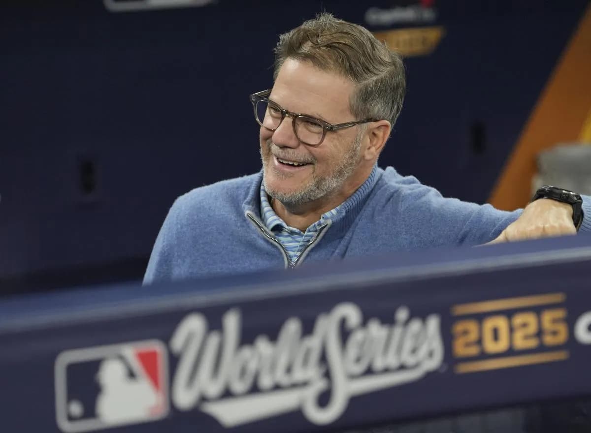 Toronto Blue Jays Executive Vice President, Baseball Operations and General Manager Ross Atkins talk during batting pratice on media day before game one of the World Series at Rogers Centre.