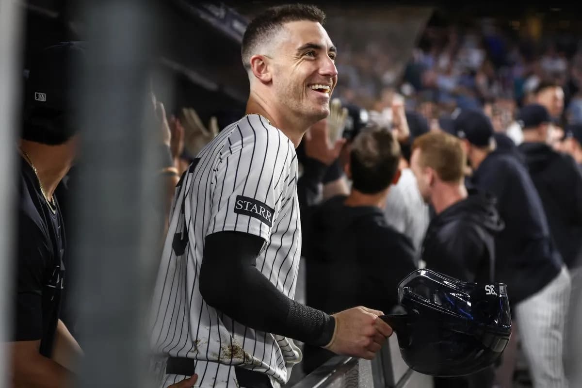 New York Yankees left fielder Cody Bellinger (35) celebrates in the dugout after scoring in the third inning against the Washington Nationals at Yankee Stadium.