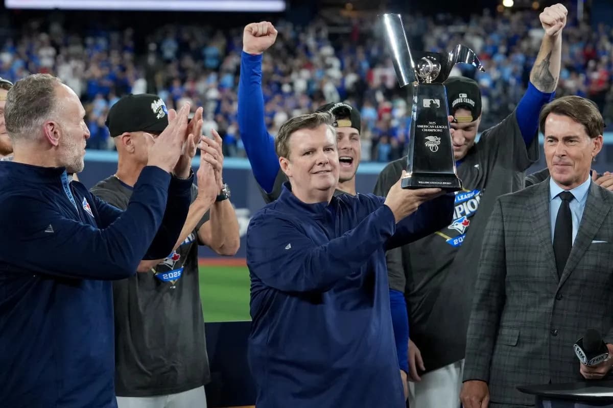 Toronto Blue Jays owner Edward Rogers celebrates with the trophy after the win against the Seattle Mariners in game seven of the ALCS round for the 2025 MLB playoffs at Rogers Centre.