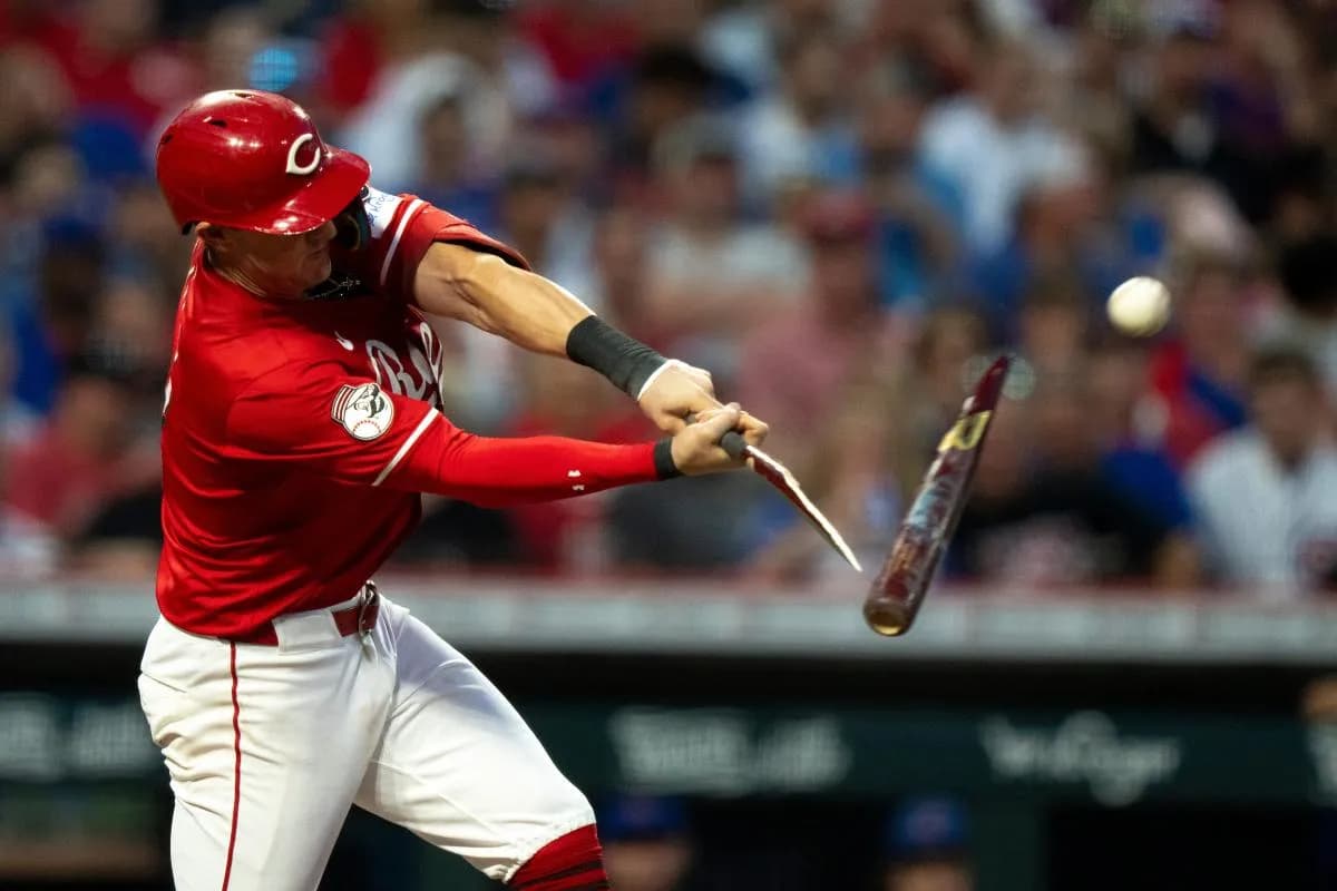 Cincinnati Reds left fielder Austin Hays (12) breaks his bat on a fly ball out in the third inning between Cincinnati Reds and Chicago Cubs at Great American Ball Park in Cincinnati on Sept. 20, 2025.