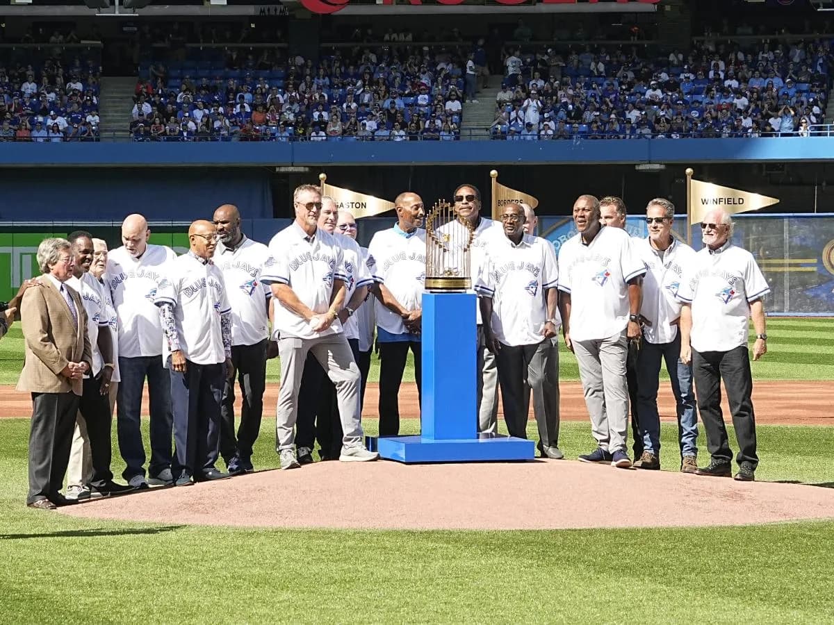 The the 1992 World Series champion Toronto Blue Jays pose for a photo after being celebrated before the start of a game against the Los Angeles Angels at Rogers Centre.