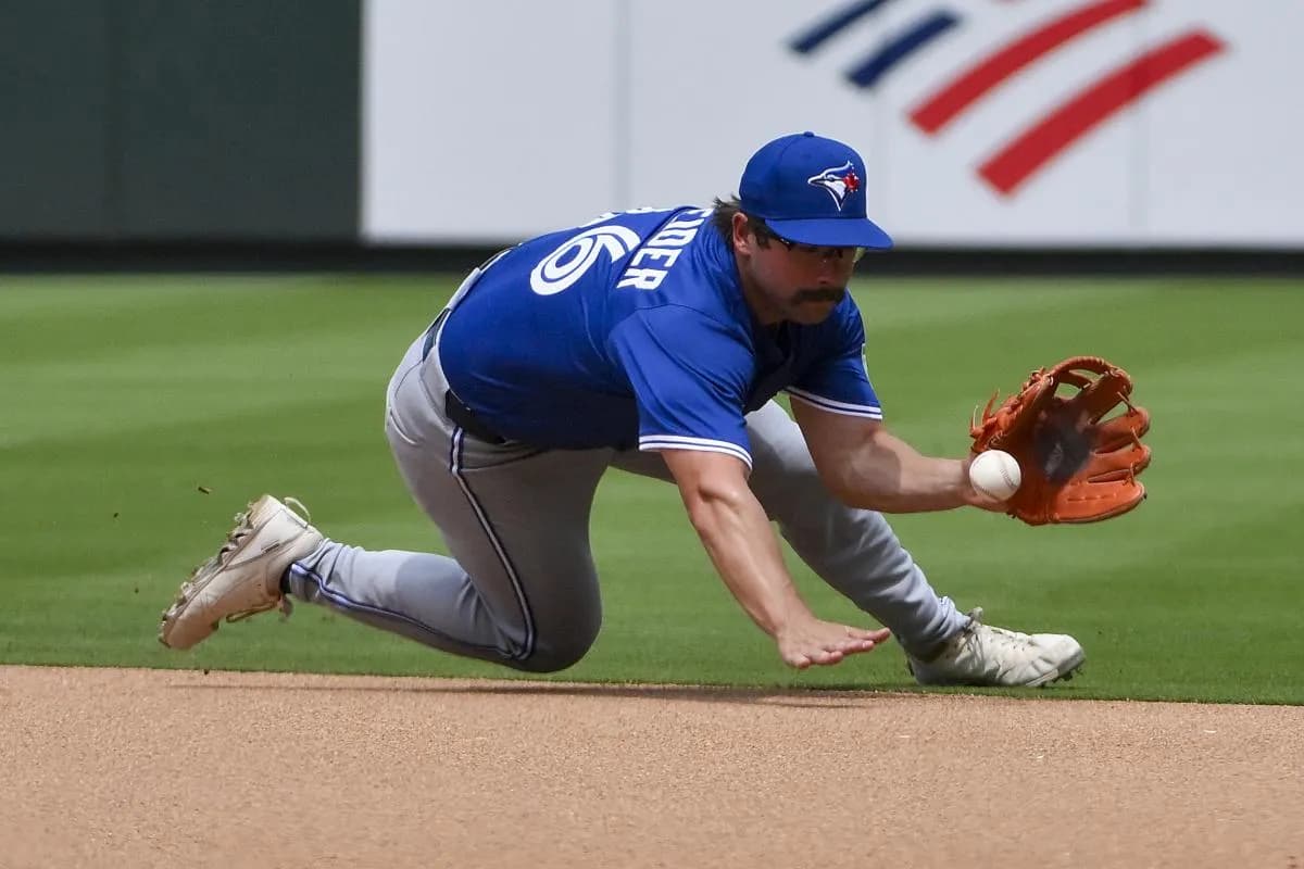 Toronto Blue Jays second baseman Davis Schneider (36) fields a ground ball against the St. Louis Cardinals during the fifth inning at Busch Stadium.