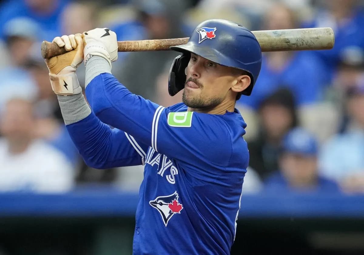 Toronto Blue Jays second base Cavan Biggio (8) hits a double during the third inning against the Kansas City Royals at Kauffman Stadium.