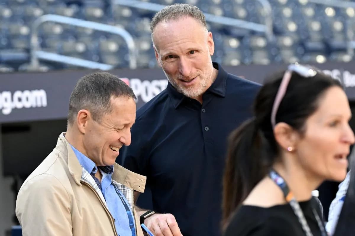 Toronto Blue Jays club president Mark Shapiro speaks with baseball journalist Ken Rosenthal during workouts at Rogers Centre.