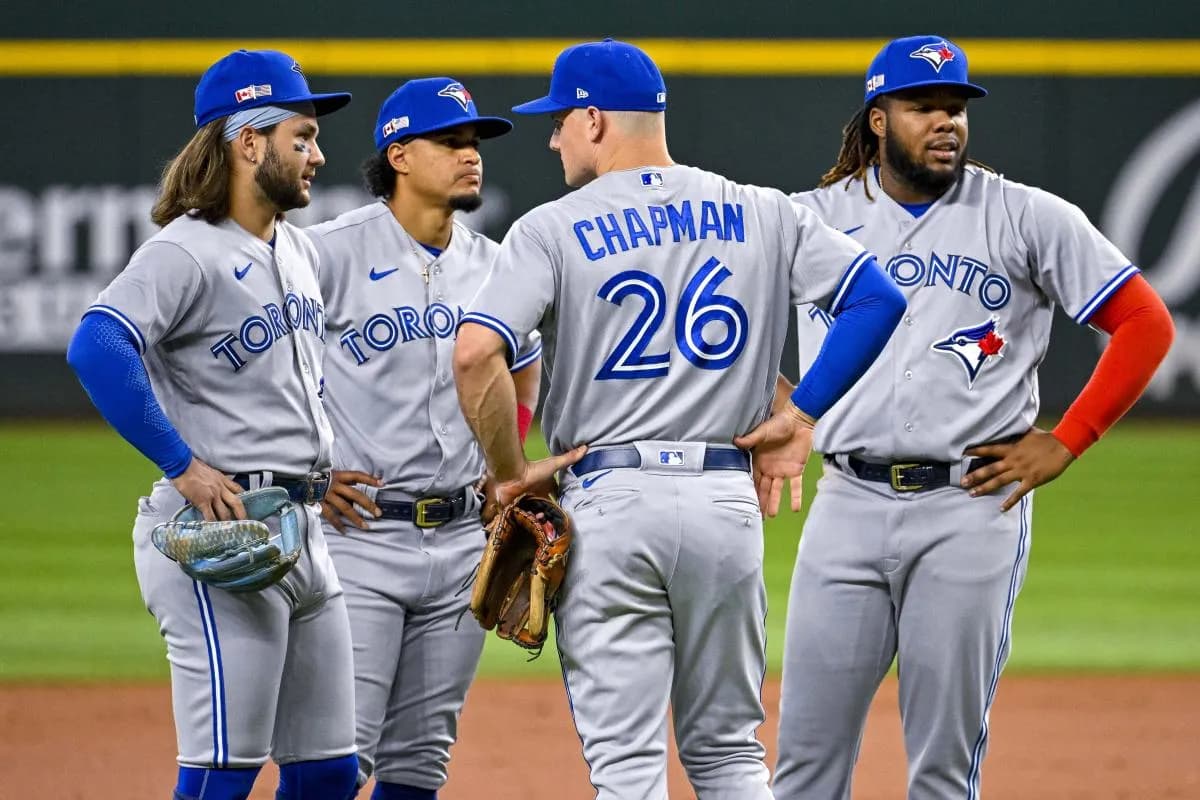 Toronto Blue Jays third baseman Matt Chapman (26) and first baseman Vladimir Guerrero Jr. (27) and shortstop Bo Bichette (11) and second baseman Santiago Espinal (5) during the game between the Texas Rangers and the Toronto Blue Jays at Globe Life Field.