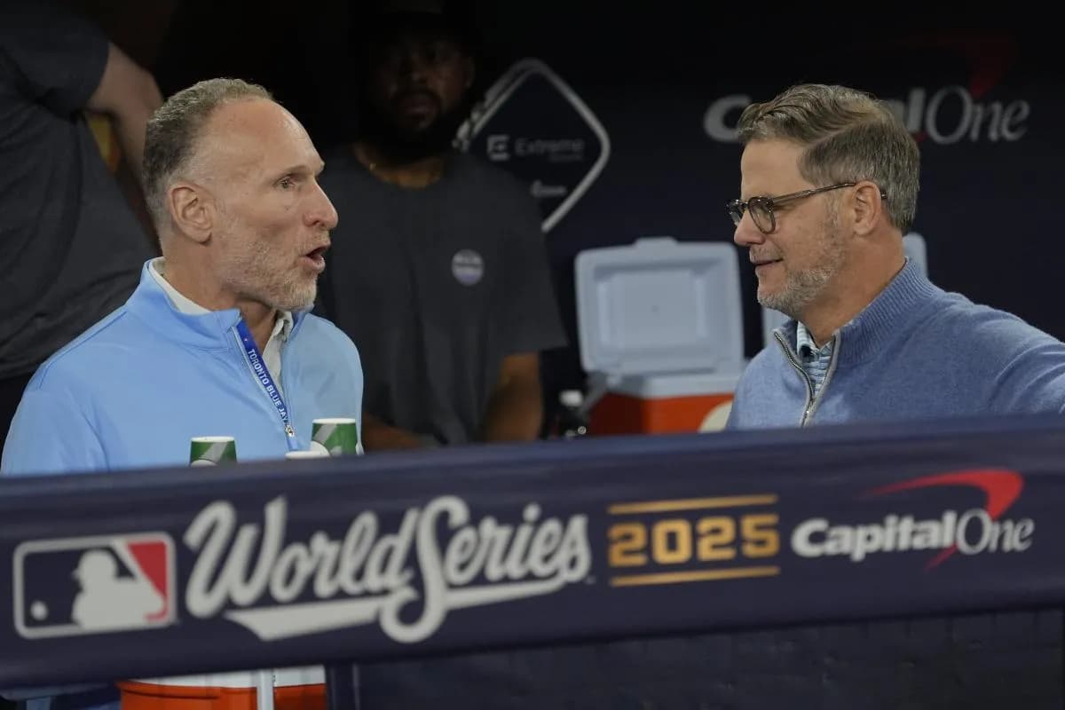 Toronto Blue Jays President and CEO Mark Shapiro and Executive Vice President, Baseball Operations and General Manager Ross Atkins talk during batting pratice on media day before game one of the World Series at Rogers Centre.