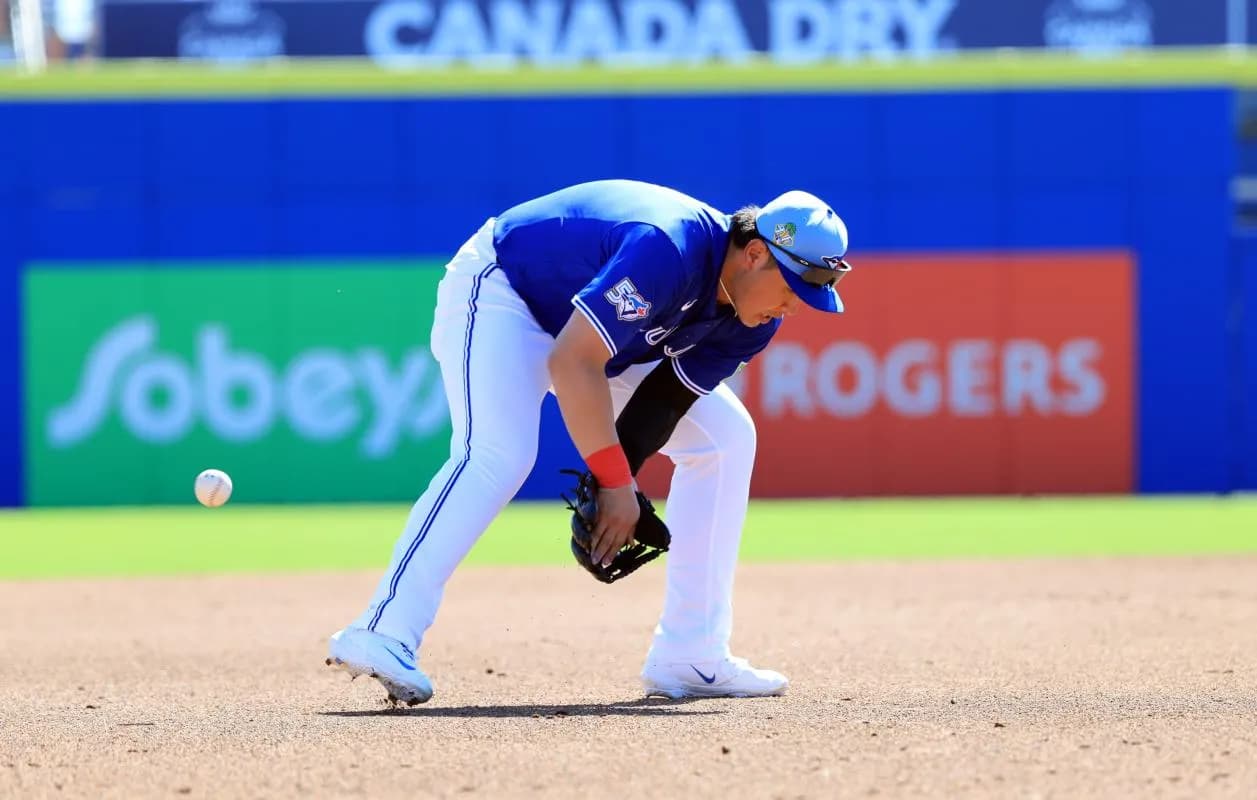 Toronto Blue Jays infielder Kazuma Okamoto (7) misses the ground ball during the second inning against the Philadelphia Phillies at TD Ballpark.