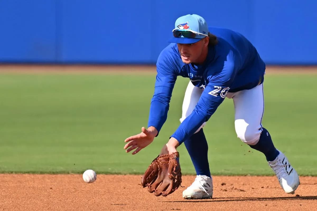 Toronto Blue Jays infielder Ben Cowles (20) fields a ground ball during spring training at Bobby Mattick Training Center at Englebert Complex.