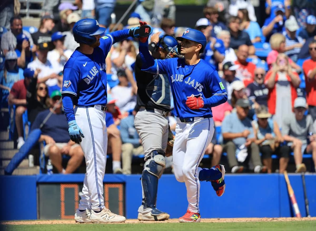 Toronto Blue Jays second baseman Andres Gimenez (0) is congratulated after hitting a two-run home run during the fifth inning against the New York Yankees at TD Ballpark.
