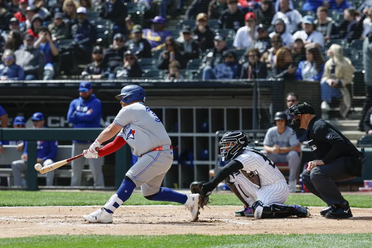 Toronto Blue Jays catcher Alejandro Kirk (30) hits an RBI-double against the Chicago White Sox during the second inning at Rate Field.