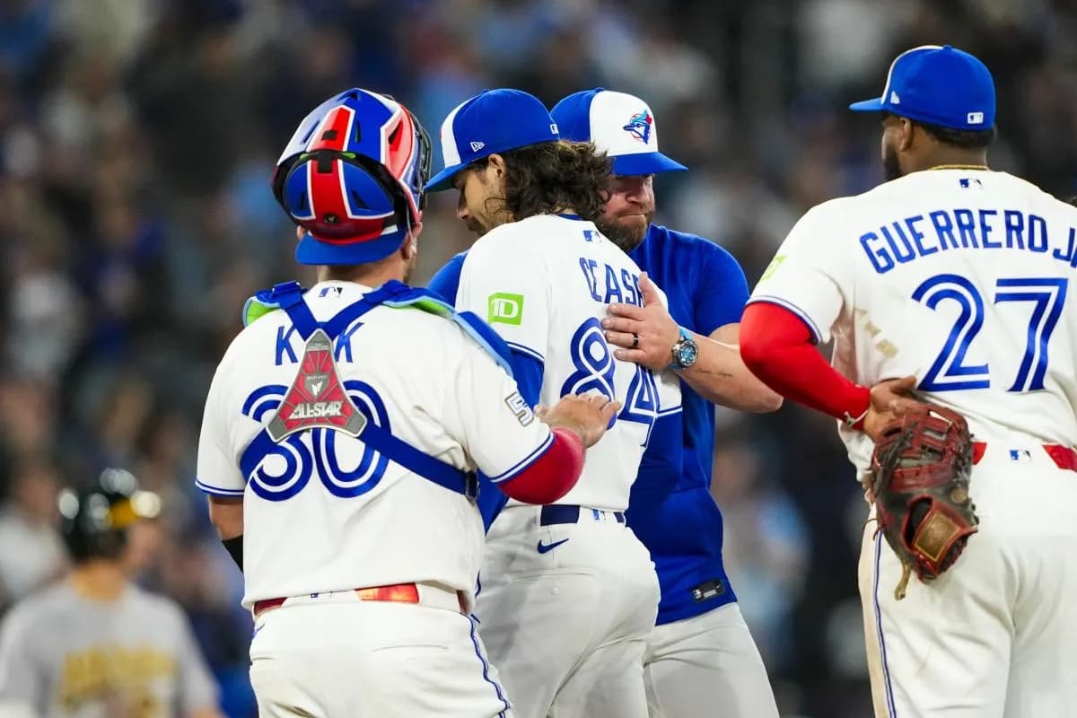 Toronto Blue Jays pitcher Dylan Cease (84) is relived by manager John Schneider (14) during the sixth inning at a MLB game against the Athletics at Rogers Centre.