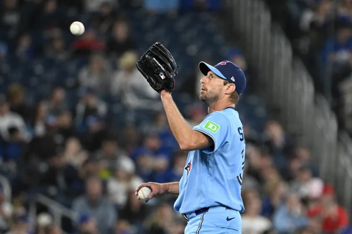 Toronto Blue Jays starting pitcher Max Scherzer (31) receives a new ball in the fourth inning against the Colorado Rockies at Rogers Centre.