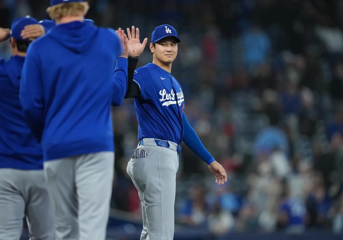 Los Angeles Dodgers designated hitter Shohei Ohtani (17) celebrates the win against the Toronto Blue Jays at the end of the ninth inning at Rogers Centre.
