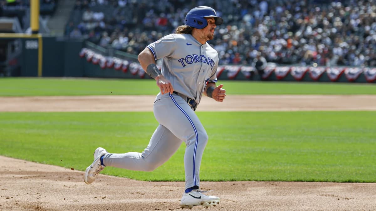 Toronto Blue Jays right fielder Addison Barger (47) runs to score against the Chicago White Sox during the second inning at Rate Field.