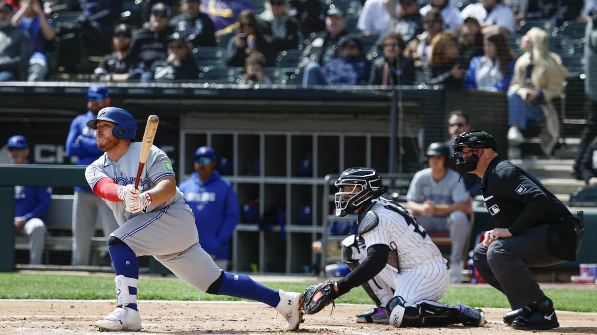 Toronto Blue Jays catcher Alejandro Kirk (30) hits an RBI-double against the Chicago White Sox during the second inning at Rate Field.