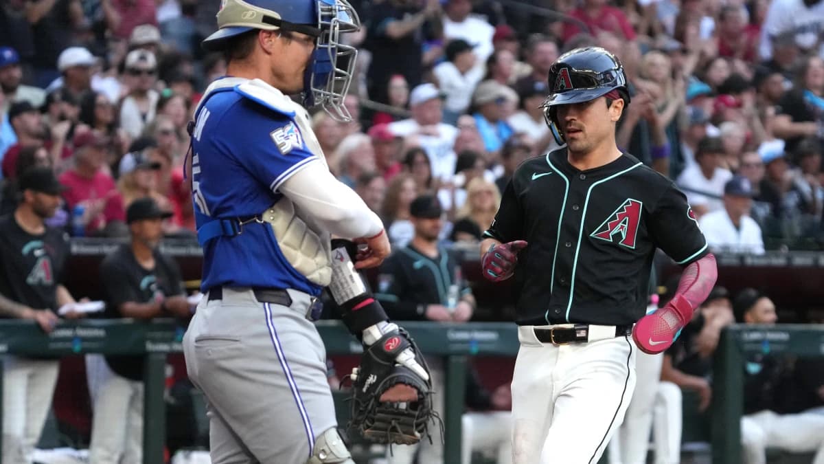 Arizona Diamondbacks right fielder Corbin Carroll (7) scores a run against the Toronto Blue Jays in the first inning at Chase Field.