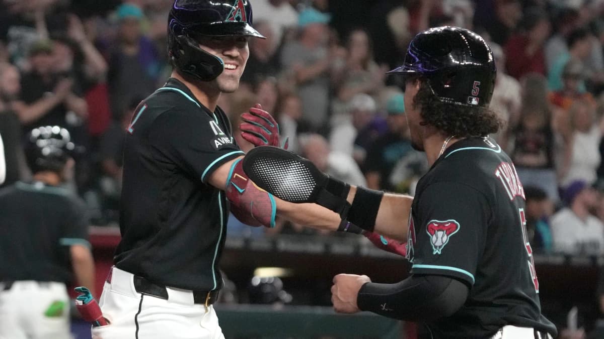 Arizona Diamondbacks right fielder Corbin Carroll (7) celebrates with center fielder Alek Thomas (5) after hitting a grand slam against the Toronto Blue Jays in the eighth inning at Chase Field.
