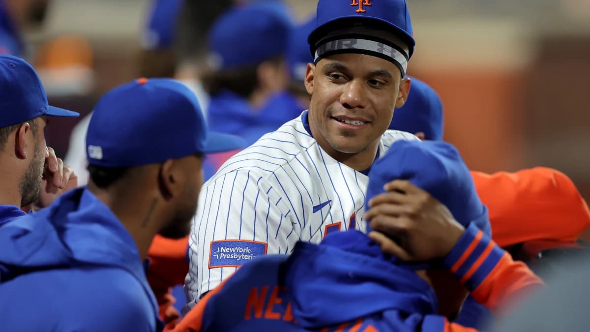 New York Mets designated hitter Juan Soto (22) talks to teammates in the dugout during the ninth inning against the Minnesota Twins at Citi Field.