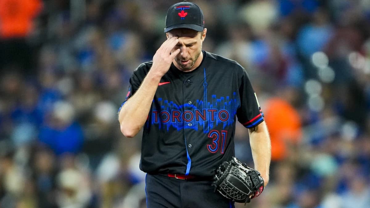Toronto Blue Jays pitcher Max Scherzer (31) touches his head during the first inning against the Cleveland Guardians at Rogers Centre.