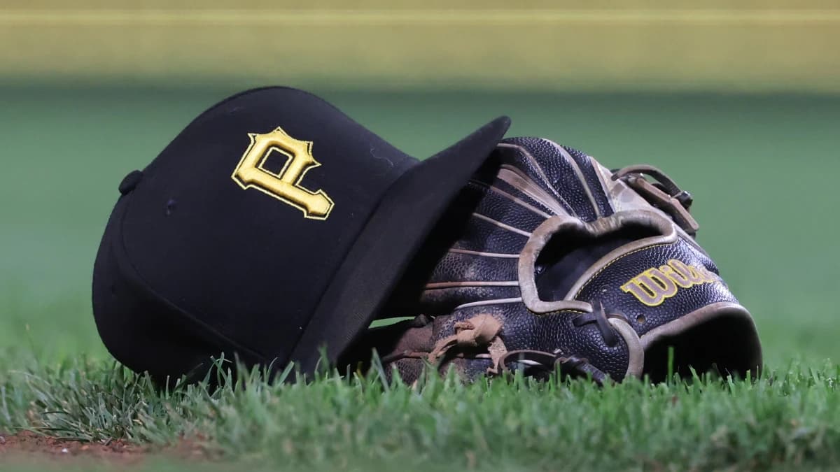 A hat and glove belonging to Pittsburgh Pirates third baseman Jared Triolo (not pictured) on the field against the Chicago Cubs during the sixth inning at PNC Park.