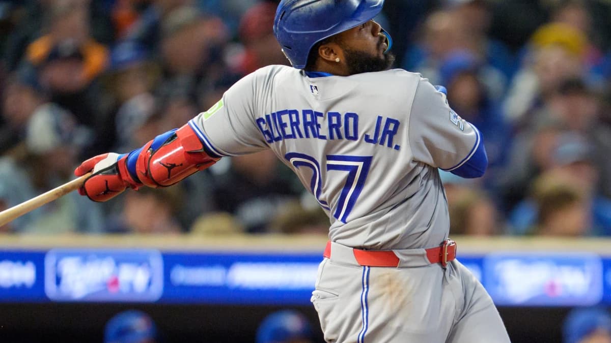 Toronto Blue Jays first baseman Vladimir Guerrero Jr. (27) hits a ball thrown by Minnesota Twins pitcher Luis Garcia (40) in the ninth inning at Target Field.