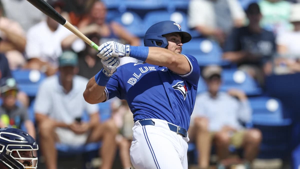 Toronto Blue Jays third baseman Addison Barger (47) hits a two-rbi single against the Detroit Tigers in the third inning during spring training at TD Ballpark.