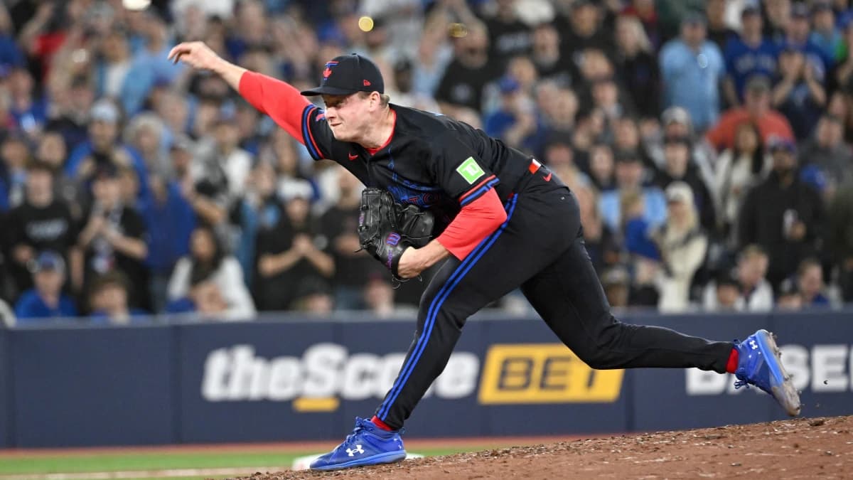 Toronto Blue Jays relief pitcher Louis Varland (77) delivers a pitch against the Los Angeles Angels in the ninth inning at Rogers Centre.