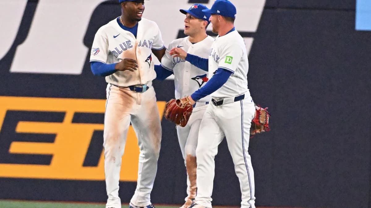 Toronto Blue Jays left field Jesus Sanchez (12) celebrates the victory over the Los Angeles Angels with center field Daulton Varsho (5) and right field Myles Straw (3) at Rogers Centre.