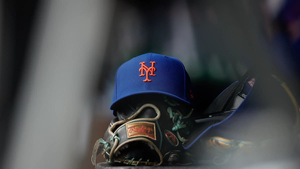 A New York Mets hat and glove in the dugout in the second inning against the Colorado Rockies at Coors Field.