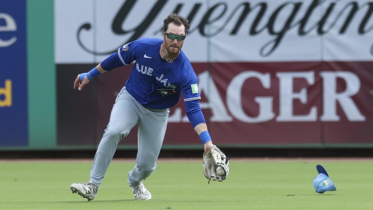 Toronto Blue Jays left fielder RJ Schreck (9) catches a ball for an pout against the Philadelphia Phillies in the third inning during spring training at BayCare Ballpark.
