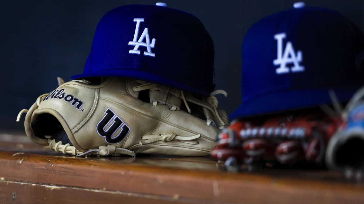 A general view of a Los Angeles Dodgers hat and glove during the second inning in the game against the Cincinnati Reds at Great American Ball Park.