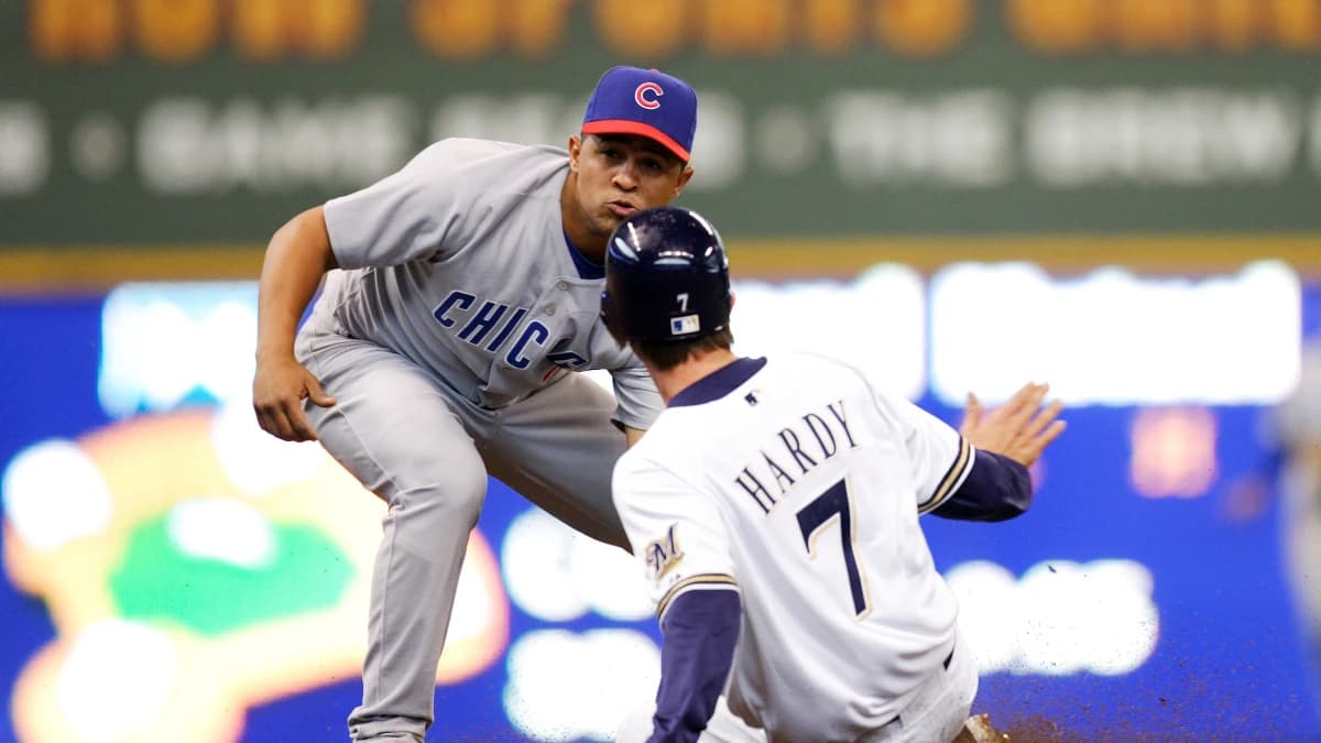 Chicago Cubs shortstop Cesar Izturis (3) tags out Milwaukee Brewers shortstop J.J. Hardy (7) completing a double-play during the fourth inning at Miller Park. The Cubs defeated the Brewers 6-3.