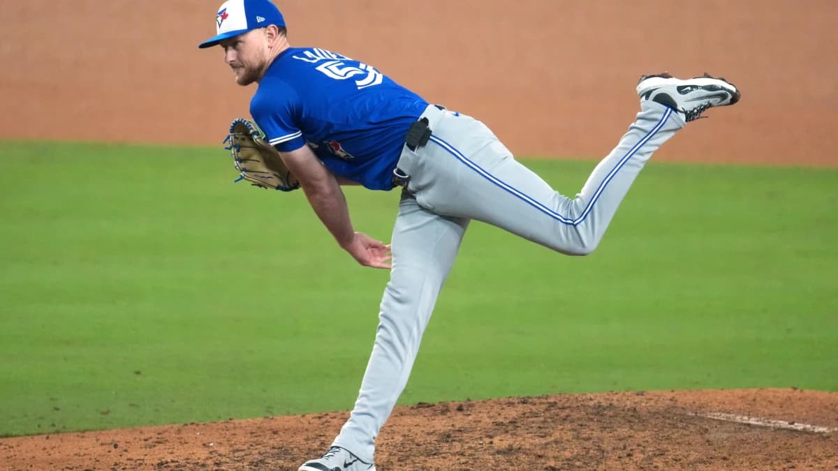 Toronto Blue Jays pitcher Eric Lauer (56) throws during the twelfth inning against the Los Angeles Dodgers in game three of the 2025 MLB World Series at Dodger Stadium.