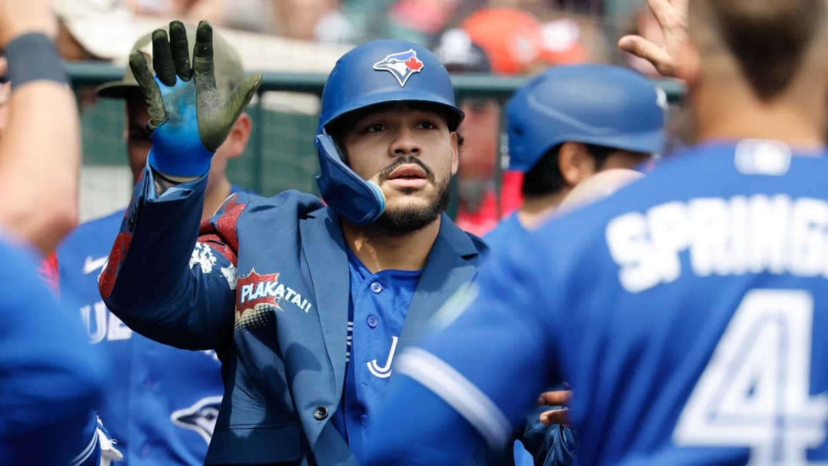 Toronto Blue Jays left fielder Yohendrick Pinango (24) receives congratulations from teammates after he hits a home run in the seventh inning against the Detroit Tigers at Comerica Park.