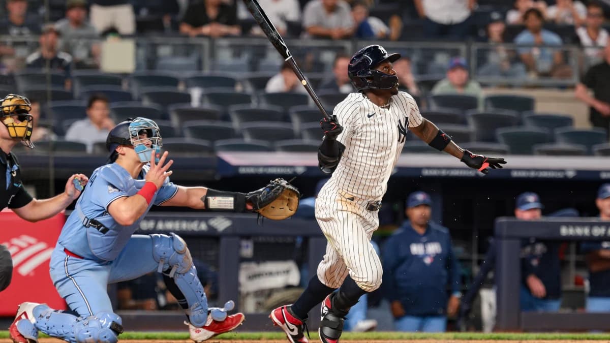 New York Yankees second baseman Jazz Chisholm Jr. (13) hits an infield single during the ninth inning against the Toronto Blue Jays at Yankee Stadium.